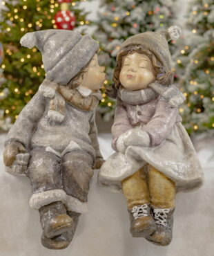 Little Boy Kissing a Little Girl with eyes Closed- In Winter Hats,