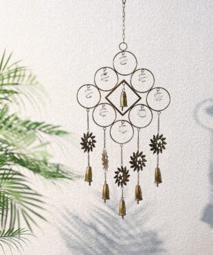 It’s a metal wind chime with round shapes and small bells hanging down. The pieces are arranged in a neat pattern and move when the wind blows.